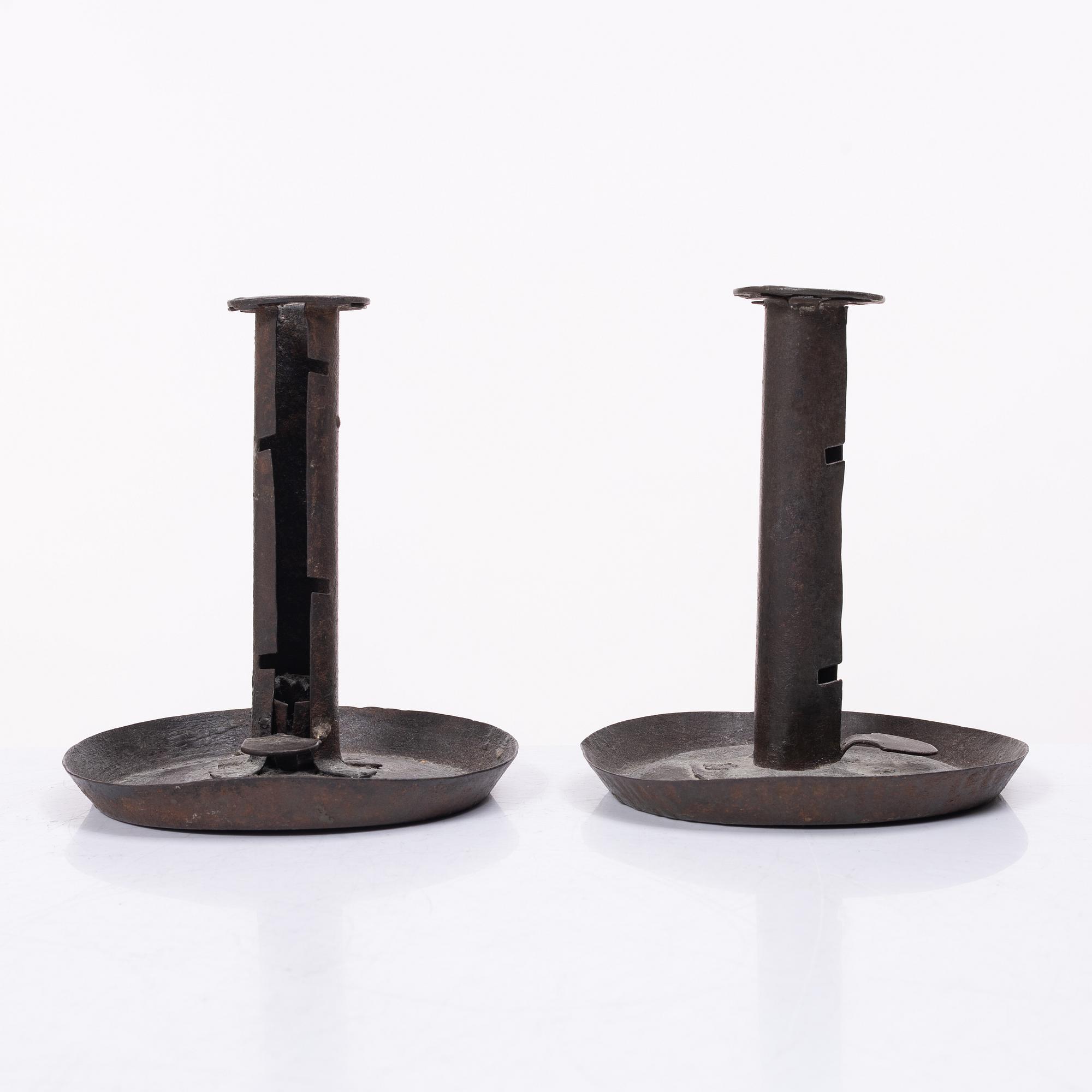 A pair of similar candle holders, 19th century.