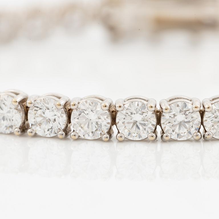 A tennis bracelet in 18K white gold set with round brilliant-cut diamonds total ca 11.50 ct, accompanied by GIA dossier.