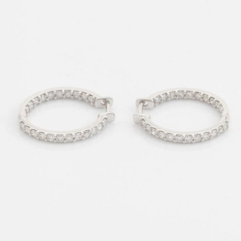 Brilliant cut diamond hoop earrings.
