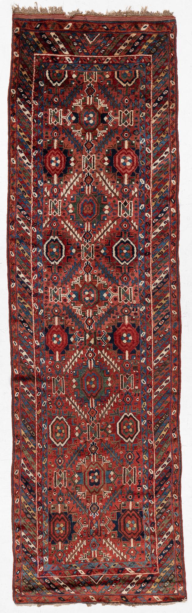 An antique Sauj Bulag runner, Eastern Kurdistan, c. 360 x 155.