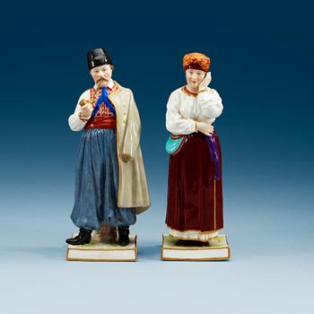 961. Two Russian figures of peasants, Popov, 19th Century.
