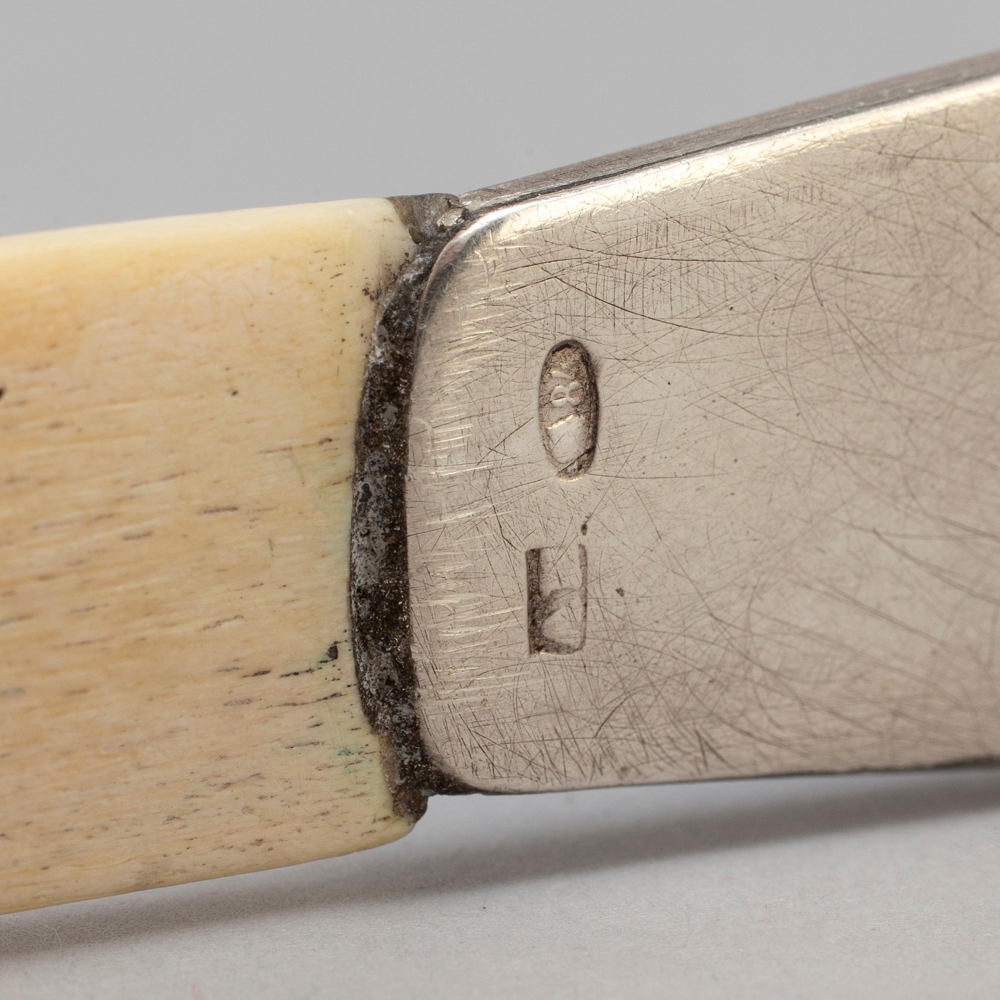 A Russian 20th century silver and translucent enamel paper knife, unidentified makers mark, Moscow 1908-1917.