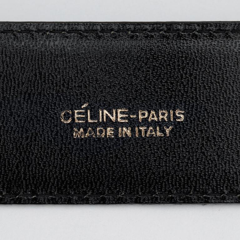 CÉLINE, a green suede belt.