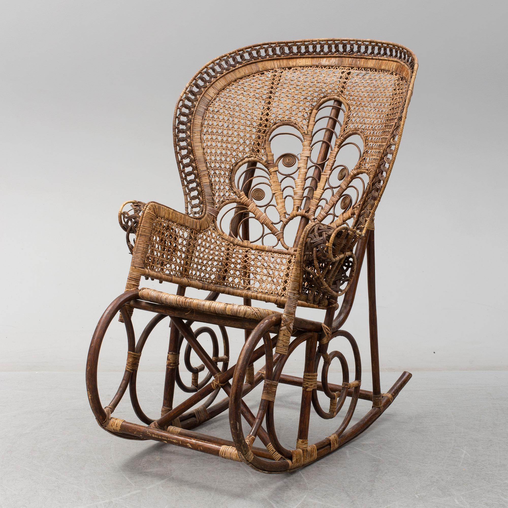 A circa 1900 rattan rocking chair. Bukowskis