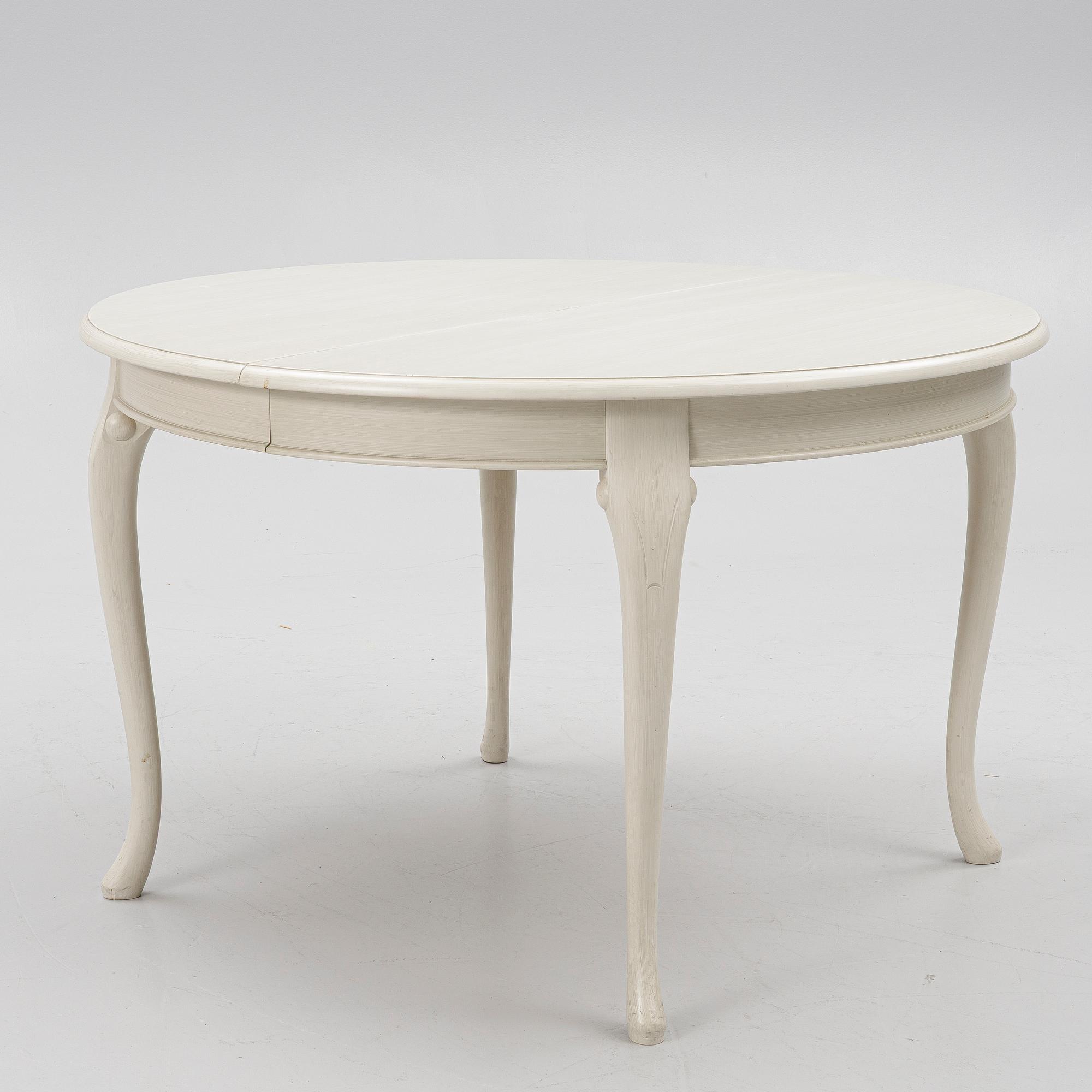 A Rococo style dining table and twelve chairs, KA Roos, Helsingborg, modern production.