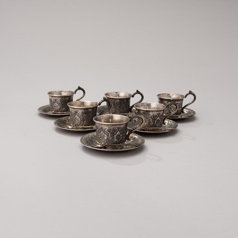 A set of six Persian silver coffee cups with spoons and saucers and six beakers, mid-20th century.