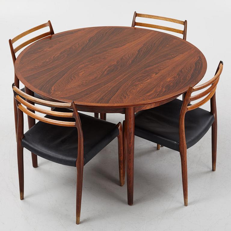 Niles Otto Møller, a rosewood veneered table with four chairs, JL Møller, Denmark, 1950's/60's.