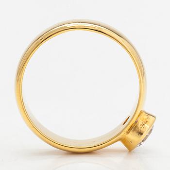 An 18K gold ring, with a brilliant-cut diamond approximately 1.11 ct with IDL certificate.