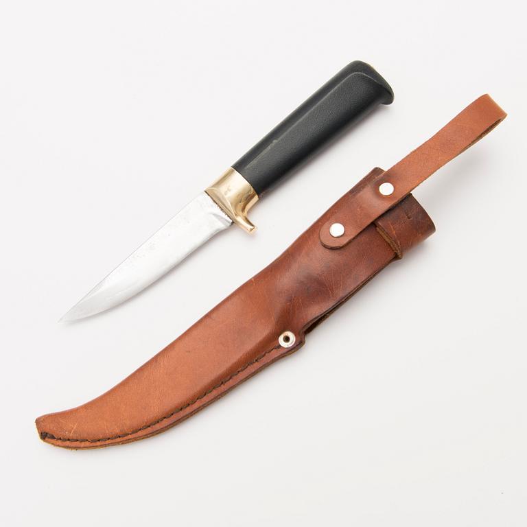 A 1970s Finnish puukko knife in stainless steel, nylon and brass designed by Tapio Wirkkala, Lapin Puukko.