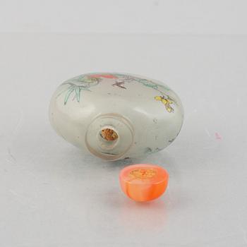 A group of nine Chinese glass and porcelain snuffbottles, 20th century.