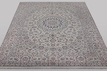 A carpet, Nain, part silk, ca 341 x 245 cm.