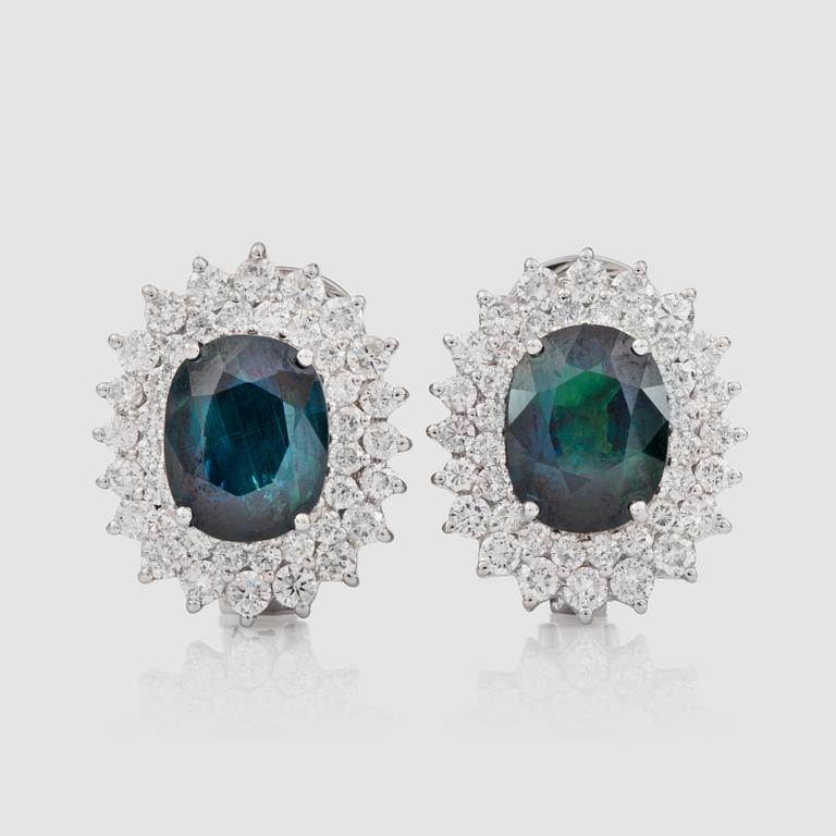 A pair of greenish-blue untreated sapphire and brilliant-cut diamond earrings.
