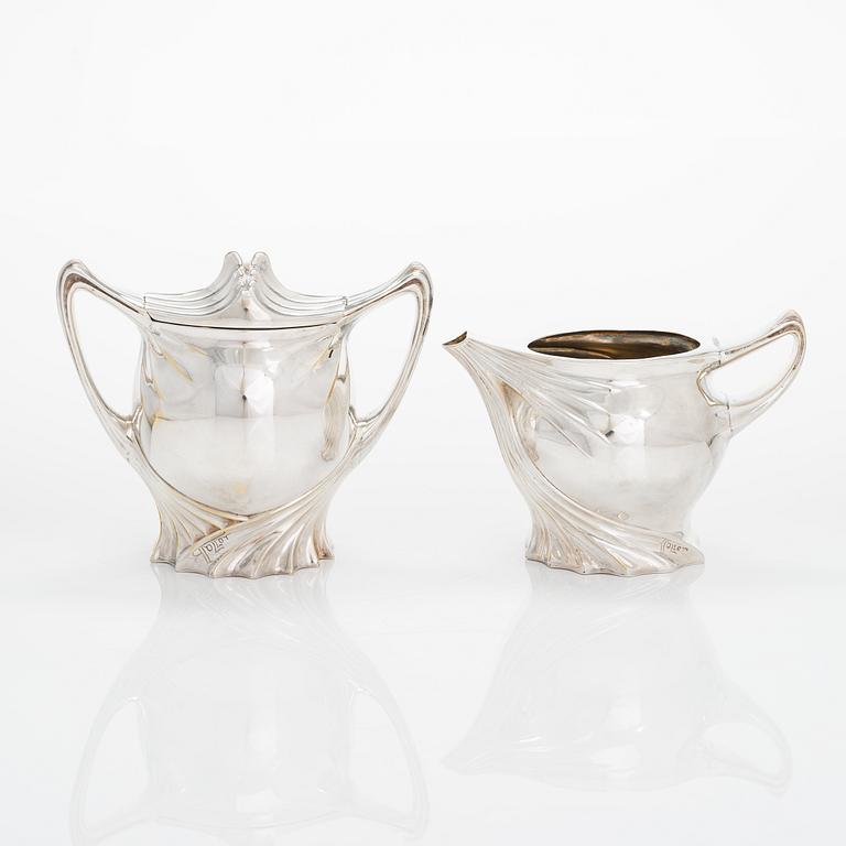 Paul Follot, a four-piece Art Nouveau silver-plated tea set, France early 20th century.