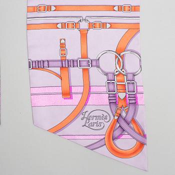 Hermès, a Maxi Twilly, 'Grand Manège' silk scarf.
