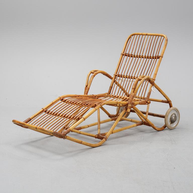 A rattan lounge chair.