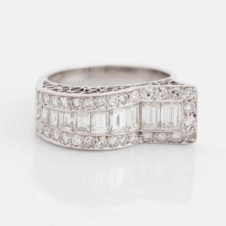 An 18K white gold ring set with baguette- and eight-cut diamonds.