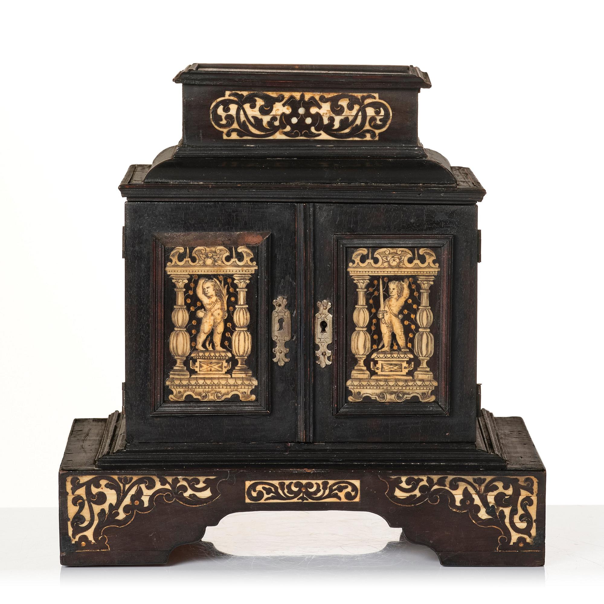 A South German, presumably Augsburg, ebony, ebonised and engraved bone inlaid table cabinet,  17th century.