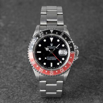 1056. Rolex, GMT-Master II, "Coke", ca 1993.