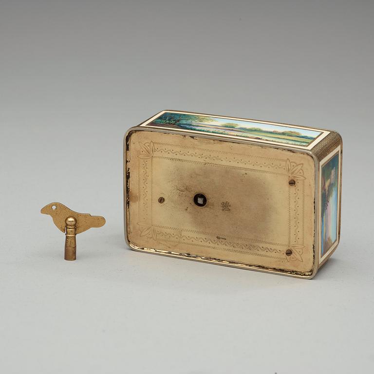 A Swiss early 20th century gilt metal and enamel music-box.