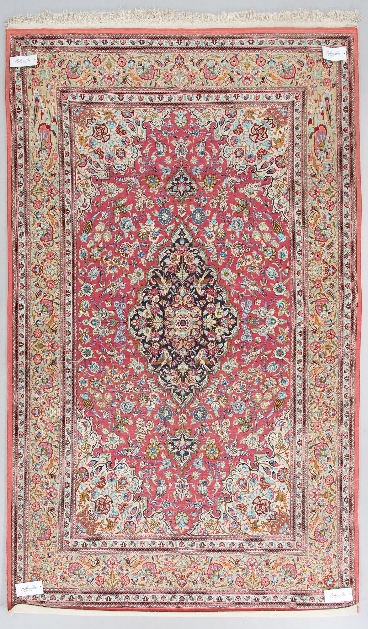 A silk Qum rug, central Persia, approx. 232 x 137 cm.