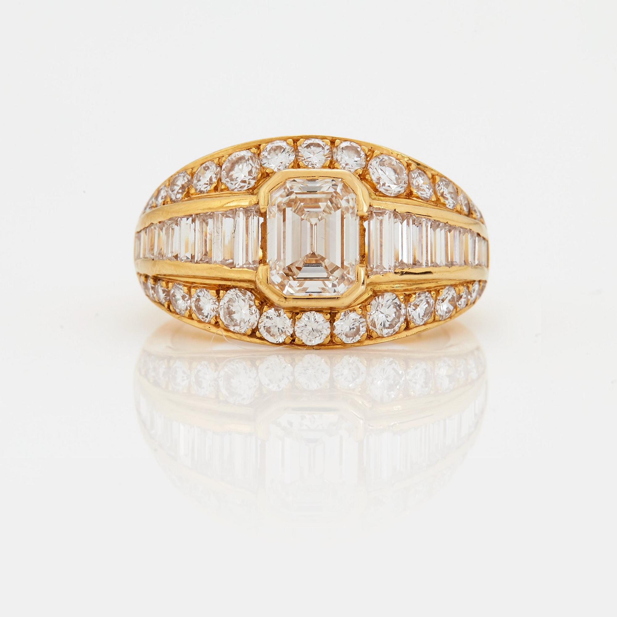 A RING set with an emerald-cut diamond.