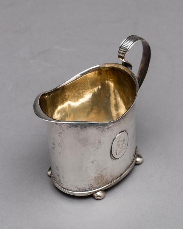 A Swedish early 19th century parcel-gilt milk-jug, mark of HI Lyberg, Borås 1820.