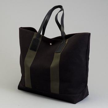 A Beach leather-trimmed canvas tote Saint Laurent.