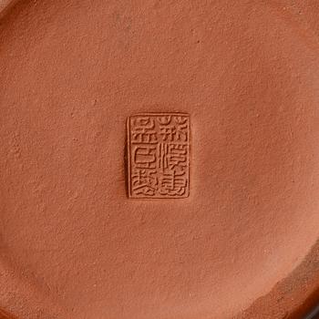 A six part red yixing Gongfu set; teapot, four cups and a tray, China, 1980s.