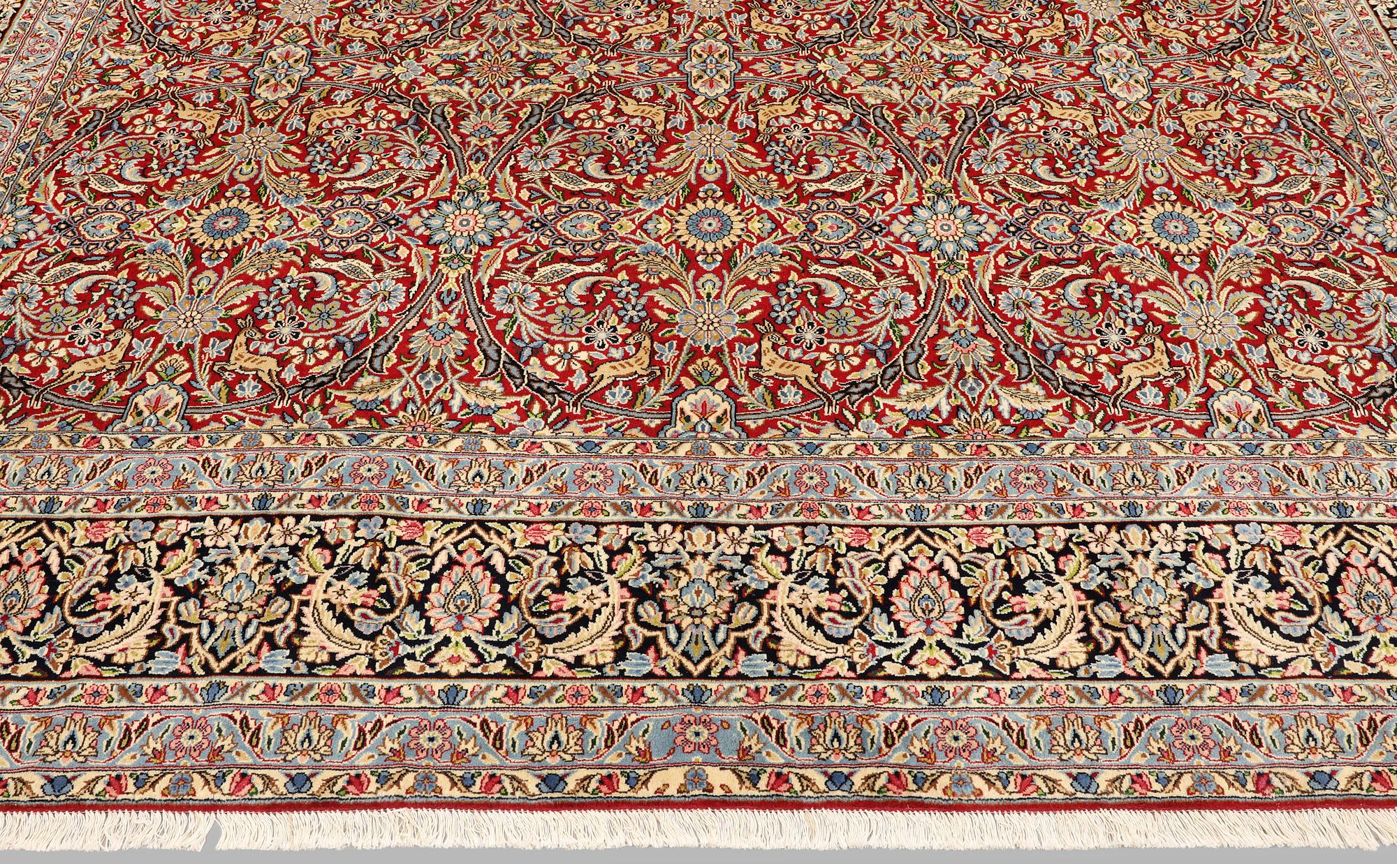 A Kirman lavar carpet, 403 x 304 cm.