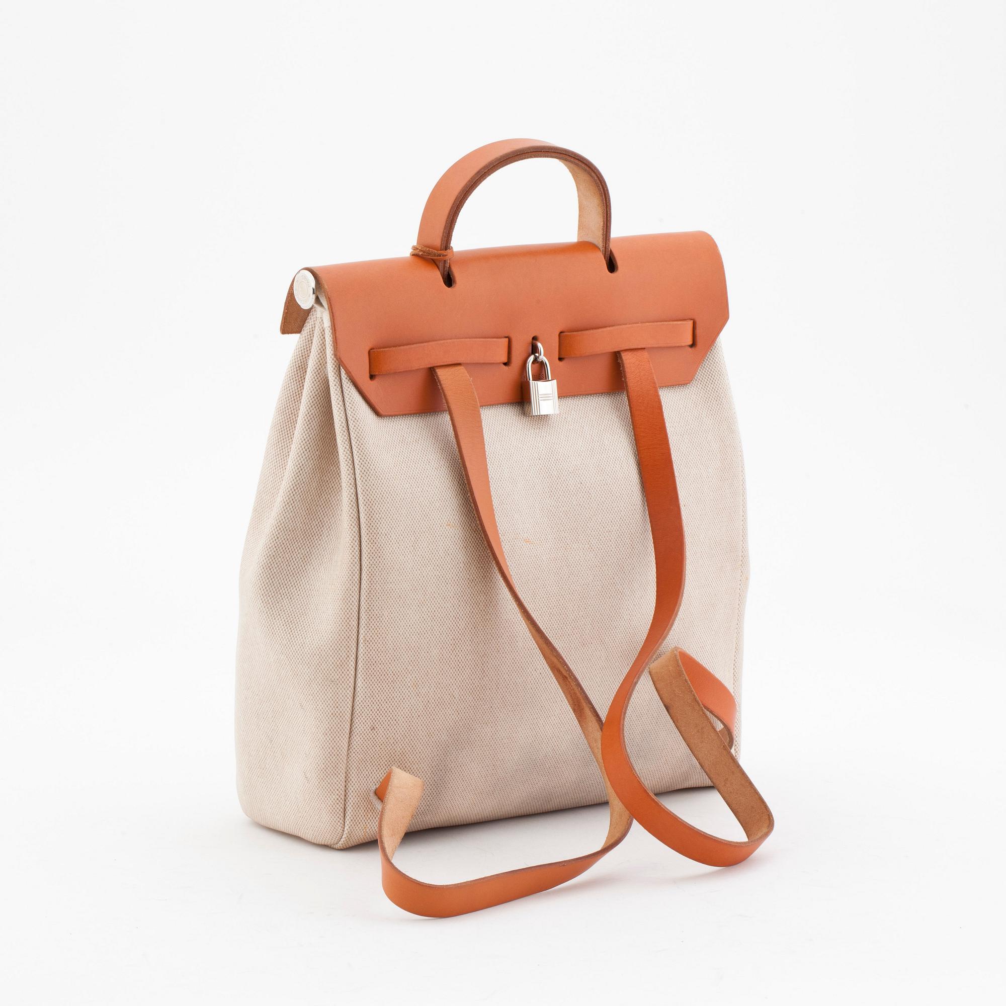 HERMÈS, a toil and vache fjord naturell "Herbag" handbag / backpack in two parts.