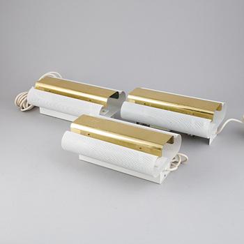 Hans-Agne Jakobsson, a set of three of 'V-451/18L'/'Rasputin' brass wall lights from Markaryd.