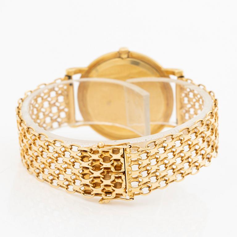 Rolex, 18K gold, with an 18K gold bracelet, wristwatch, 31.5 mm.