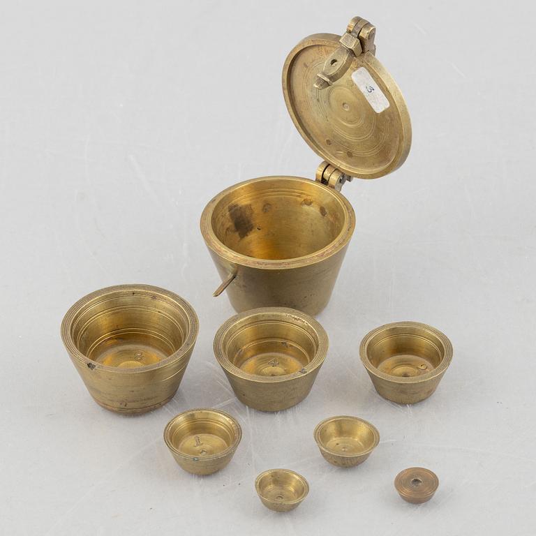 A set of three Nuremberg brass nested cup weights, one by Christoph or Johan Conrad Schön (masters 1746(1750).