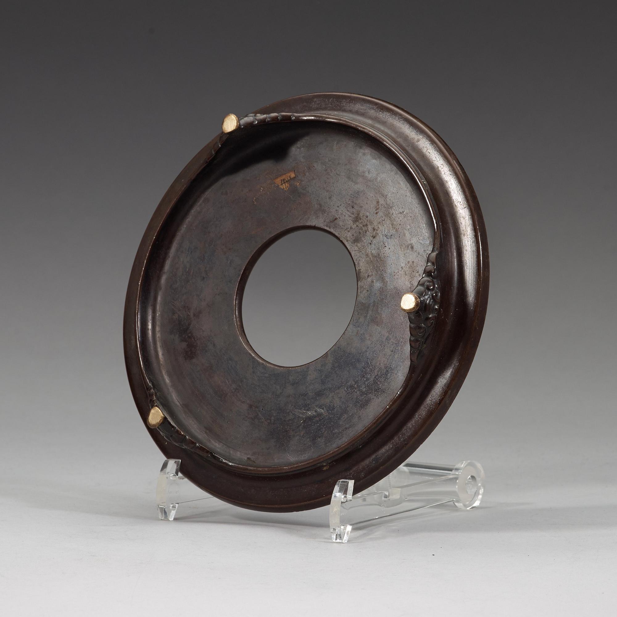 A bronze tripod censer with cover and stand, Qing dynasty, 17/18th Century.