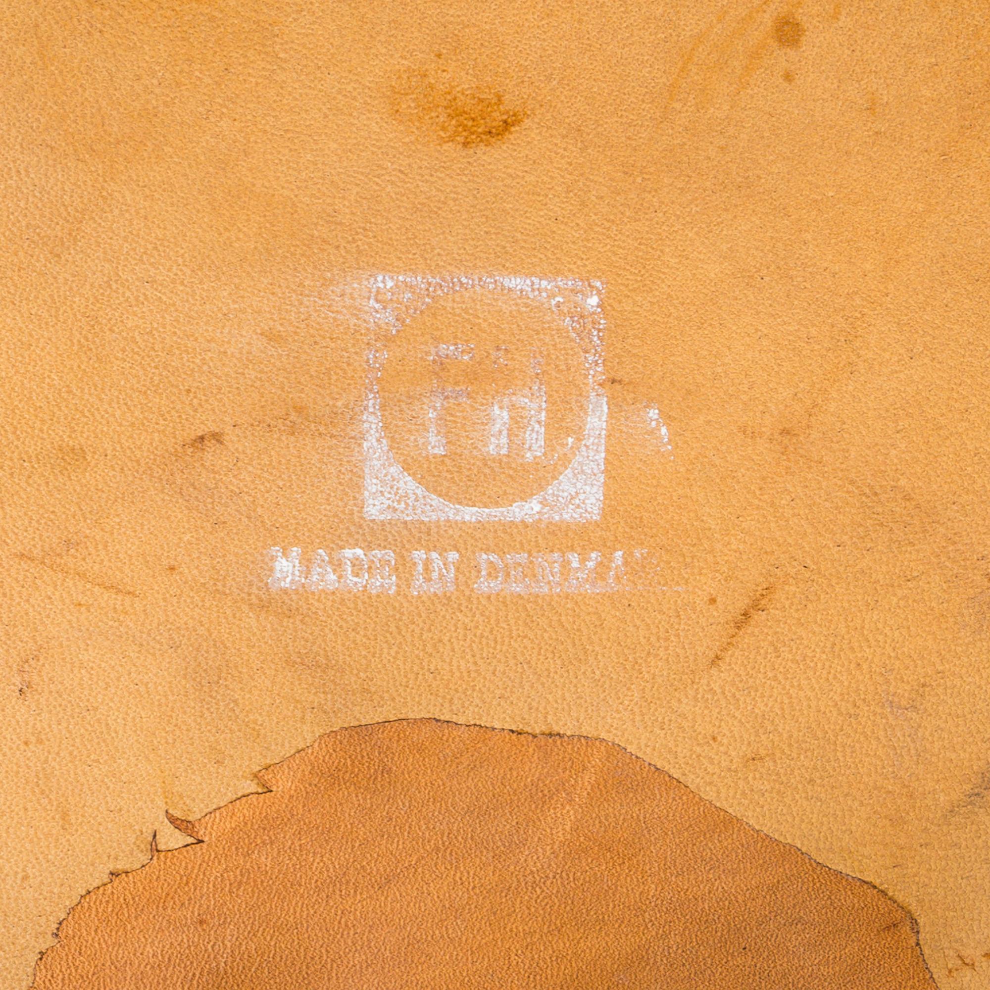 An Arne Jacobsen steel and brown leather 'Swan' chair, Fritz Hansen, Denmark 1960's.