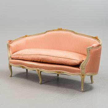 A late 20th century rococo-style sofa.