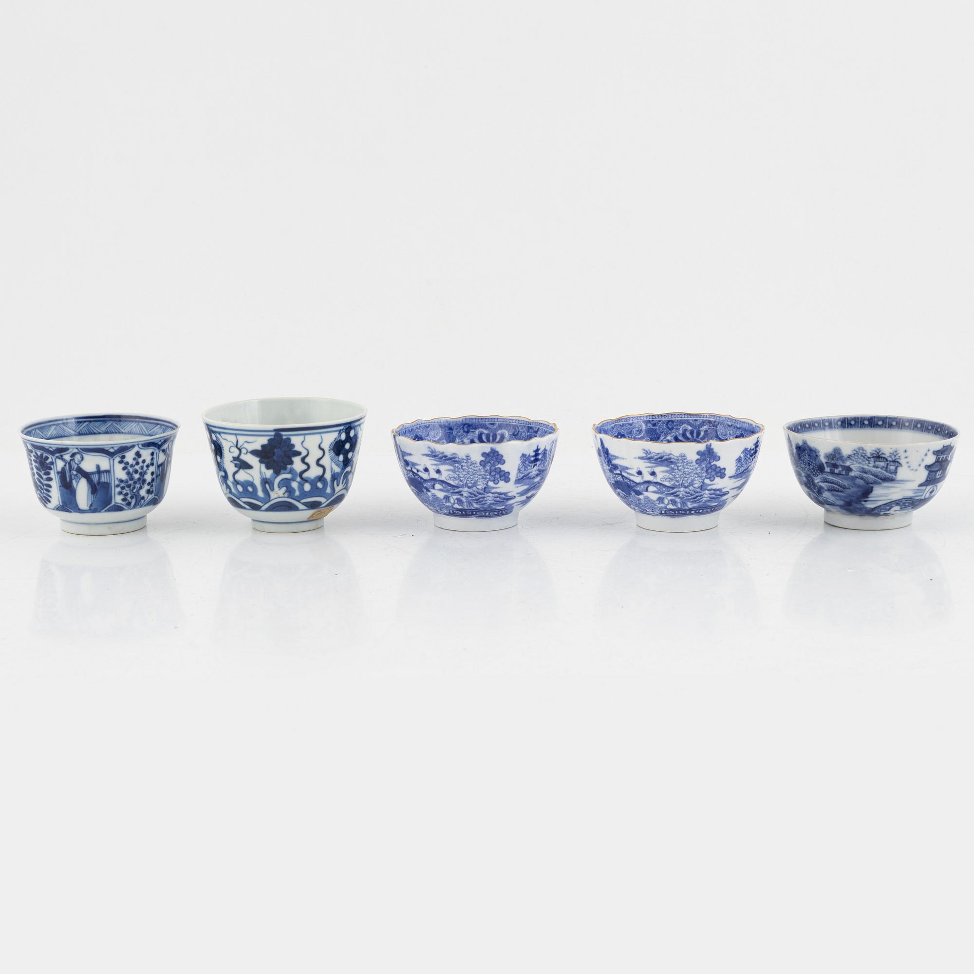 A group of thirteen cups, a bowl and a cup holder, four saucers, partly China and 18th century,