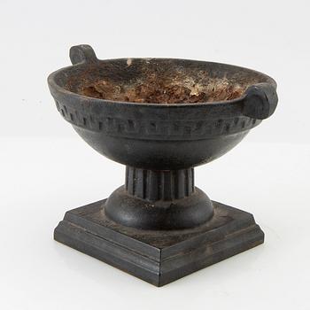 Cast iron urn, 20th century.