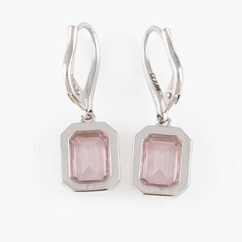 A pair of earrings with faceted morganite and round brilliant-cut diamonds.