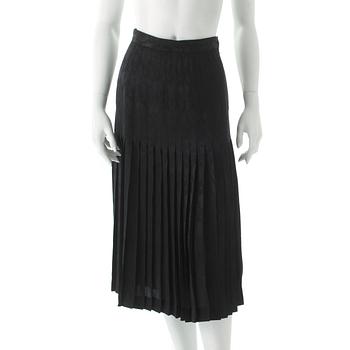 497. VALENTINO, a black silk skirt.