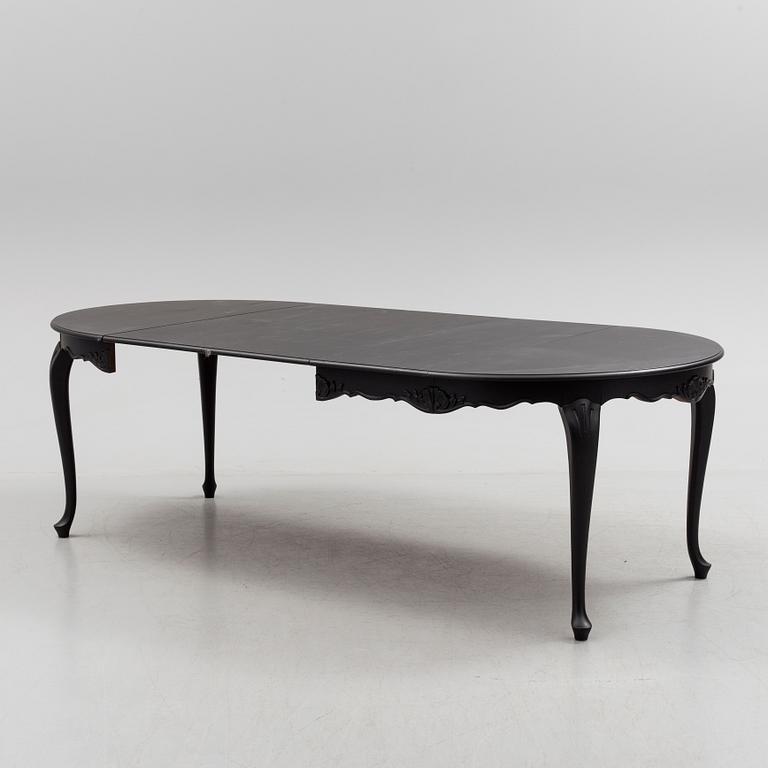 A mid 20th century rococo style dining table.