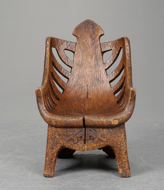 A Gustaf Fjaestad art noveau sculptured pine armchair, Sweden 1894.