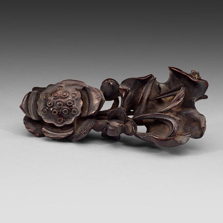 A finely carved Zitan "Lotus" stand, Qing Dynasty (1644-1912).
