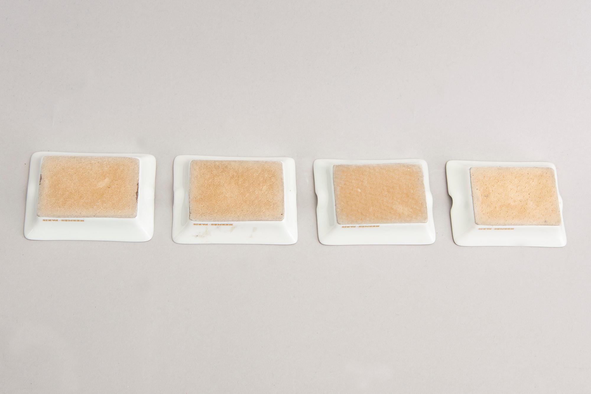 Hermès a set of four porcelain ashtrays later part of the 20th century.