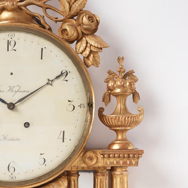 A Gustavian giltwood cartel clock by H. Wessman (watchmaker in Stockholm 1787-1805).