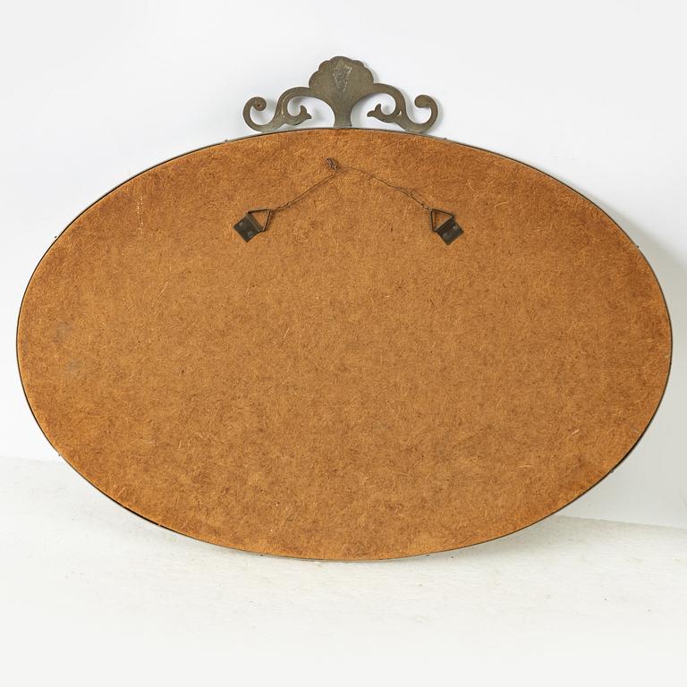A Swedish Grace pewter mirror, 1920s/30s.