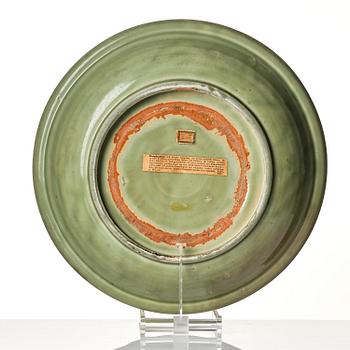 A large carved longquan celadon 'lotus' dish, Song/Ming dynasty.