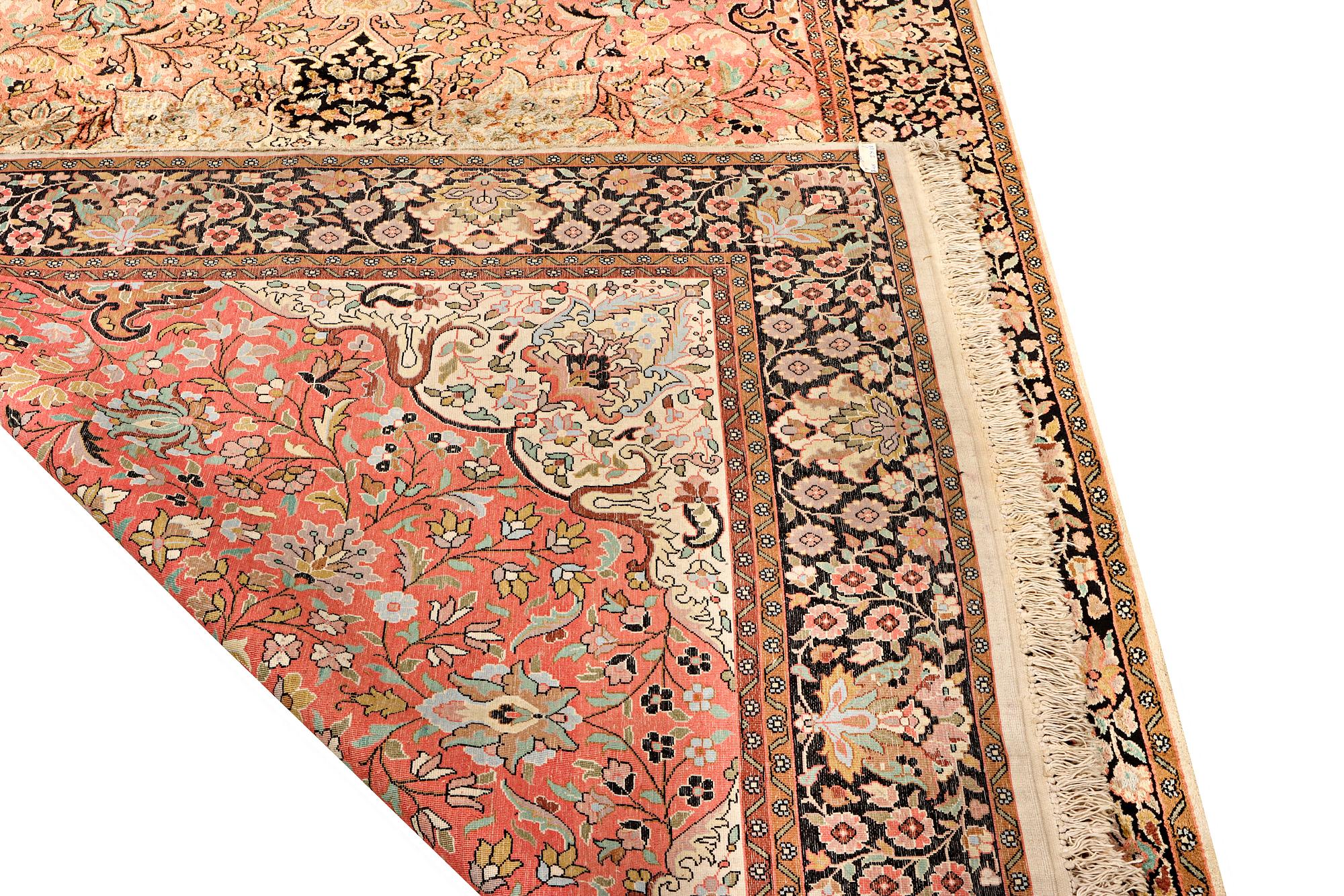 A silk Kashmar carpet, c. 280 x 177 cm.