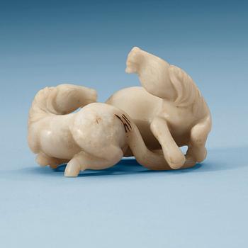 1409. A nephrite figure of horses, China.