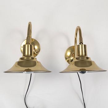 A pair of brass wall lamps by Börje Claes, late 20th century.